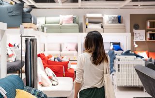 Young woman choosing furniture