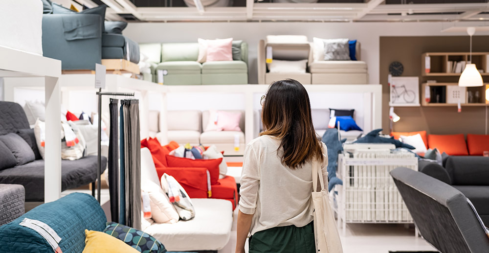 Young woman choosing furniture millennials furniture buying habits